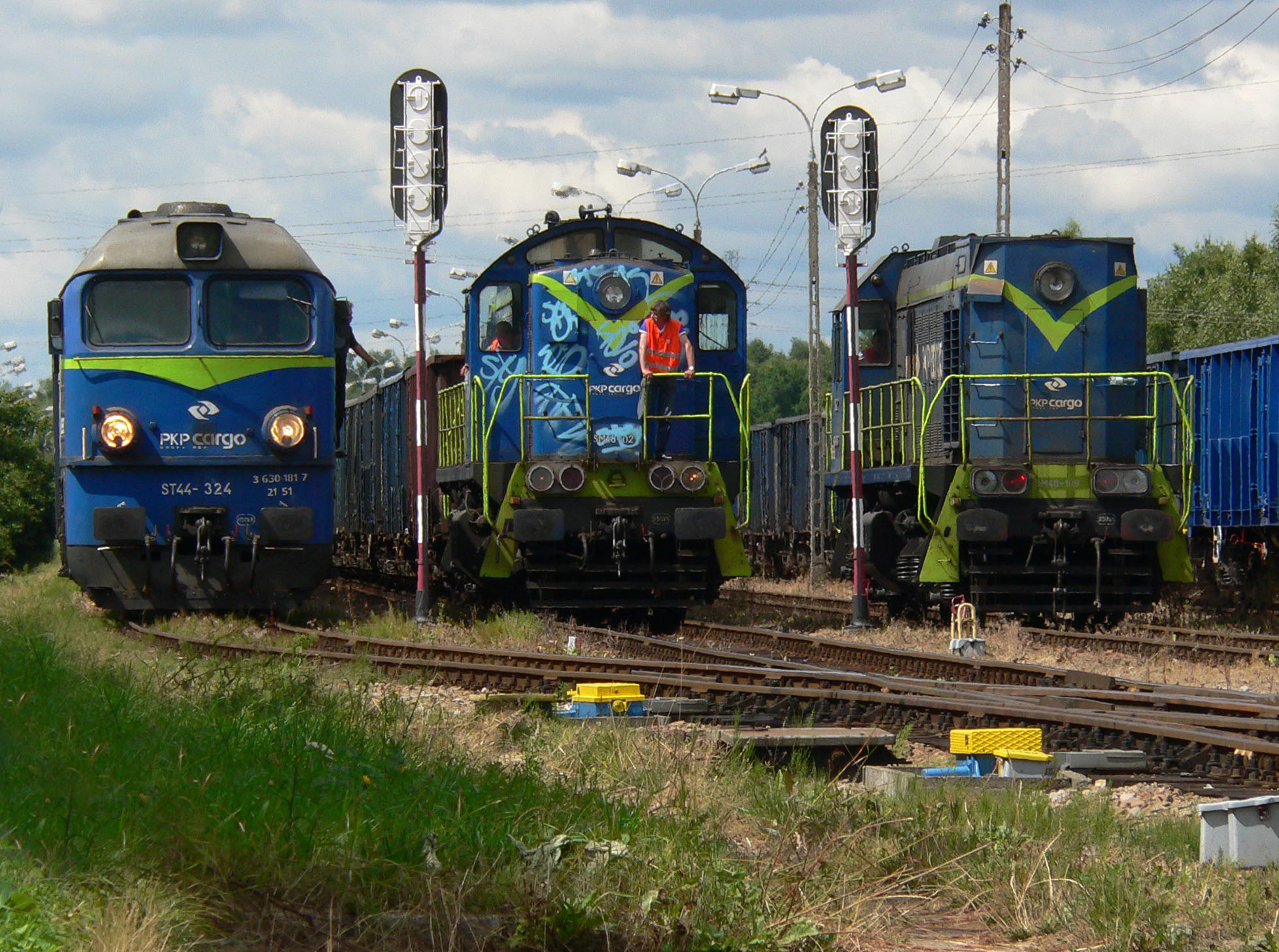 Steam locomotives waiting at a small freight station.